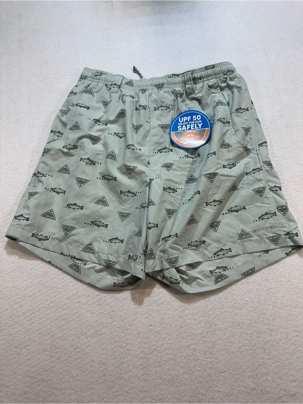 New with tags.  Columbia PFG Pale Green Swim Trunks with Fish Print